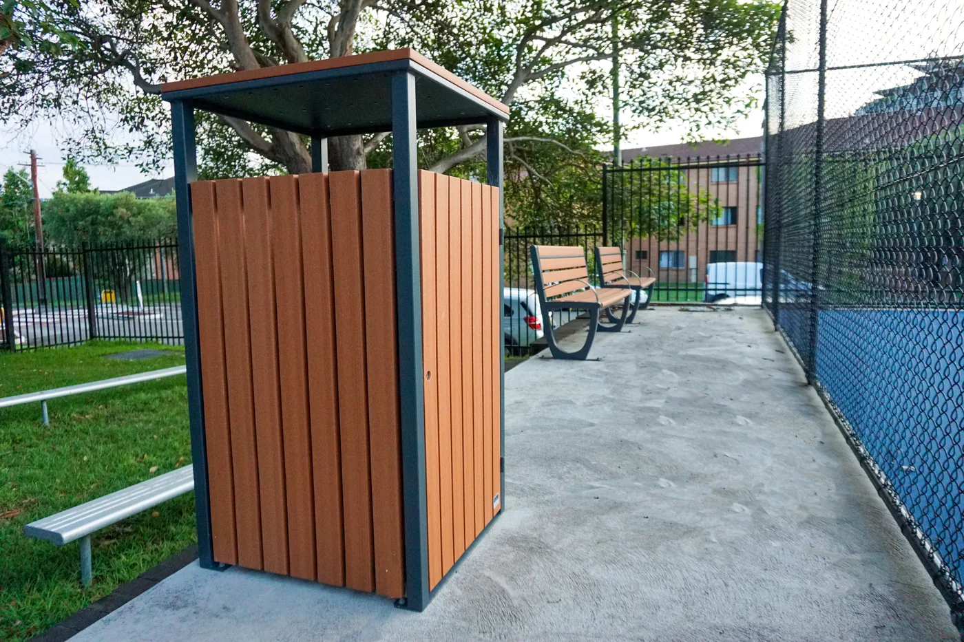 Bronte timber-look recycled plastic wheelie bin enclosure at a school