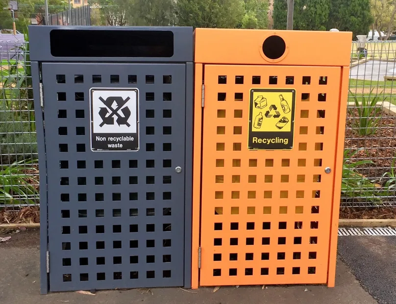 Forest bin enclosure in black and orange