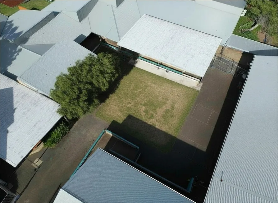 Bare school courtyard before landscaping