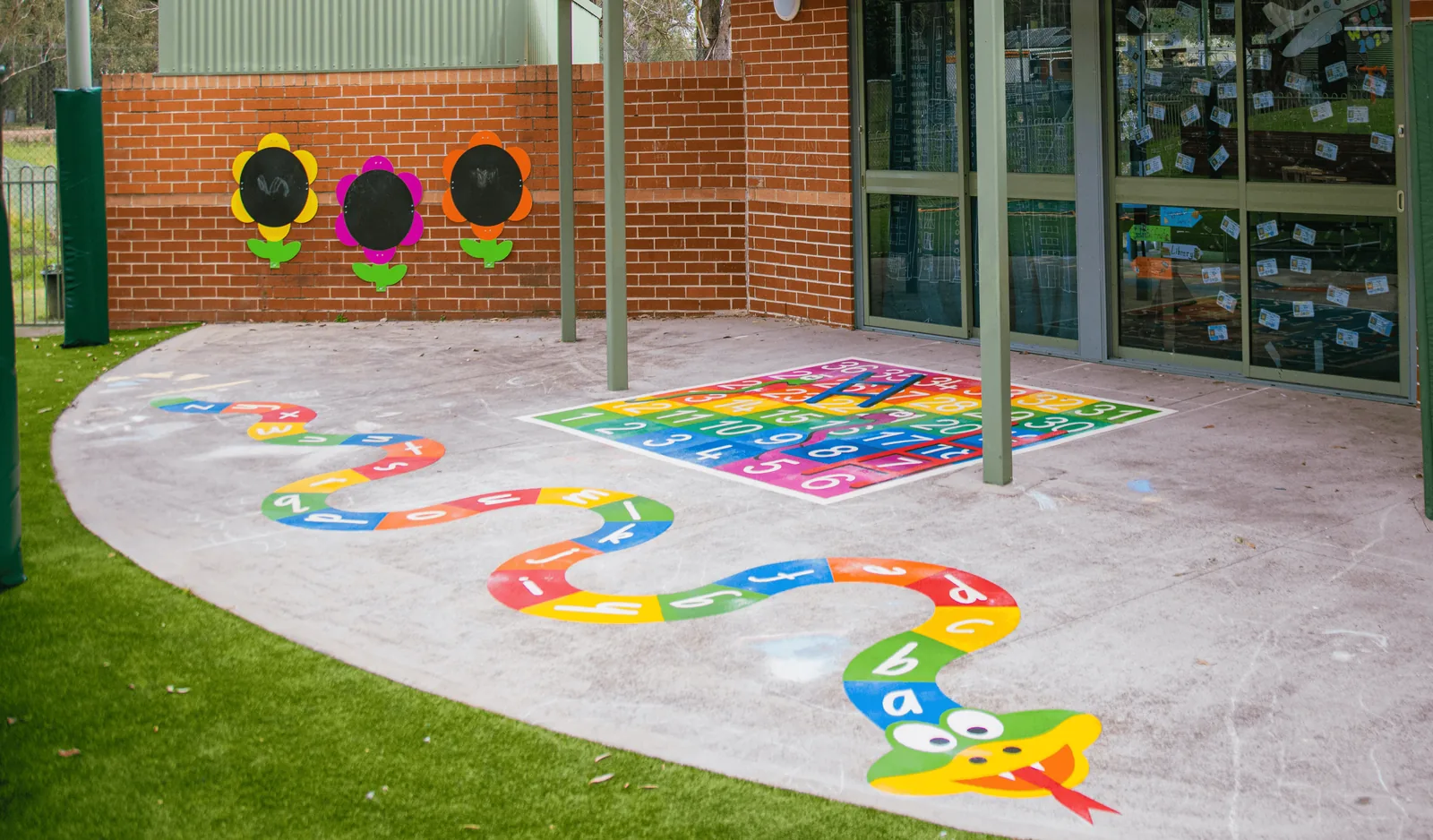 The same play area after thermoplastic playground markings were installed