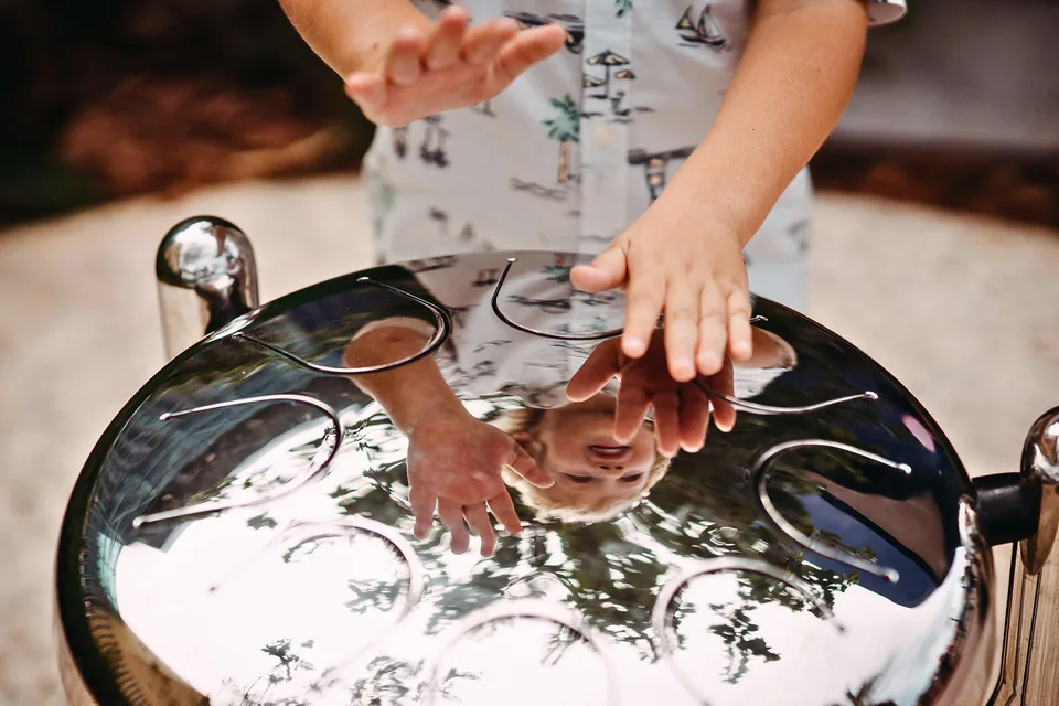 Hands playing a babel drum