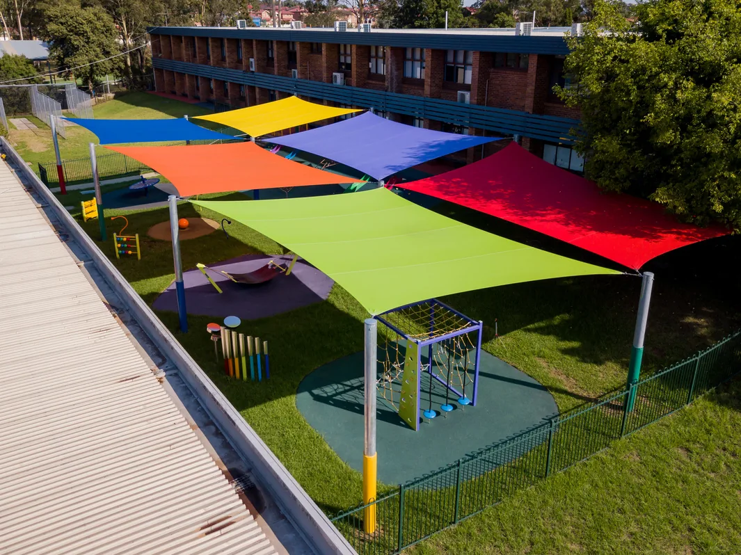 Colourful shade sails over a school playground